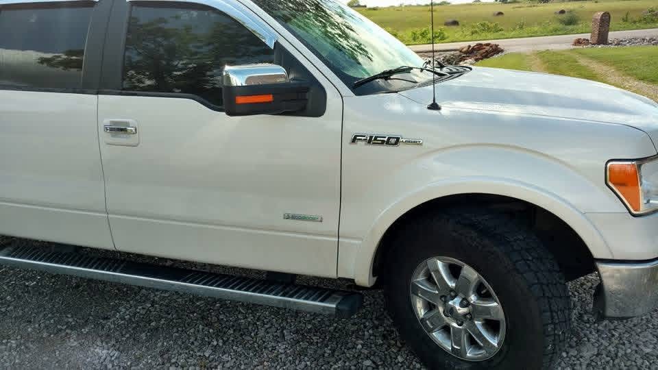White Ford F-150 front three-quarter view after detailing