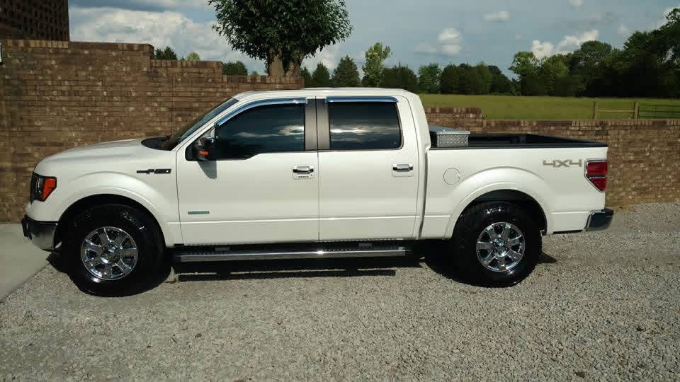 White Ford F-150 side profile after detailing