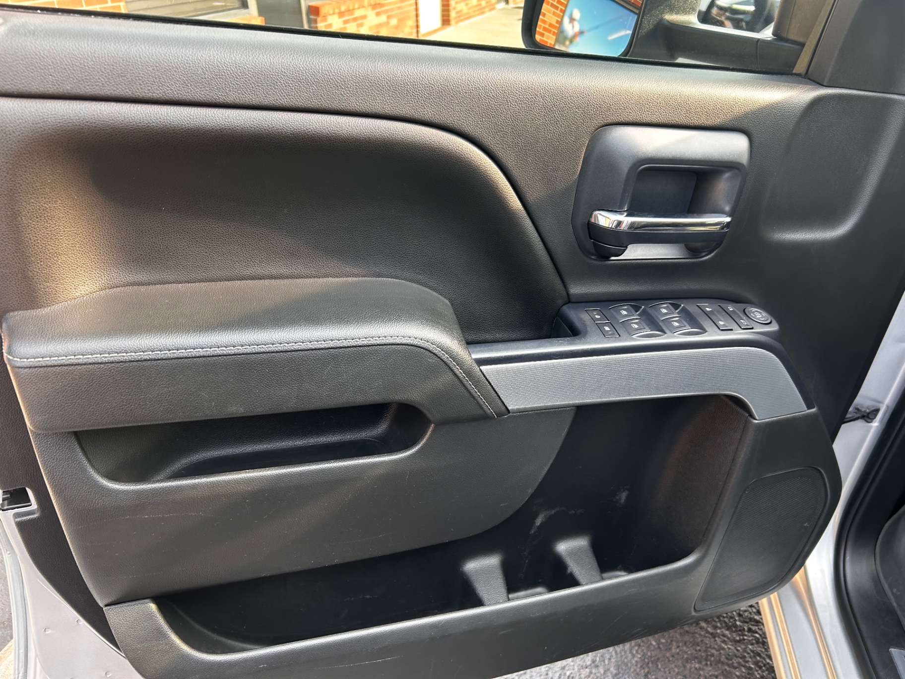 Clean truck door panel with armrest and window switches