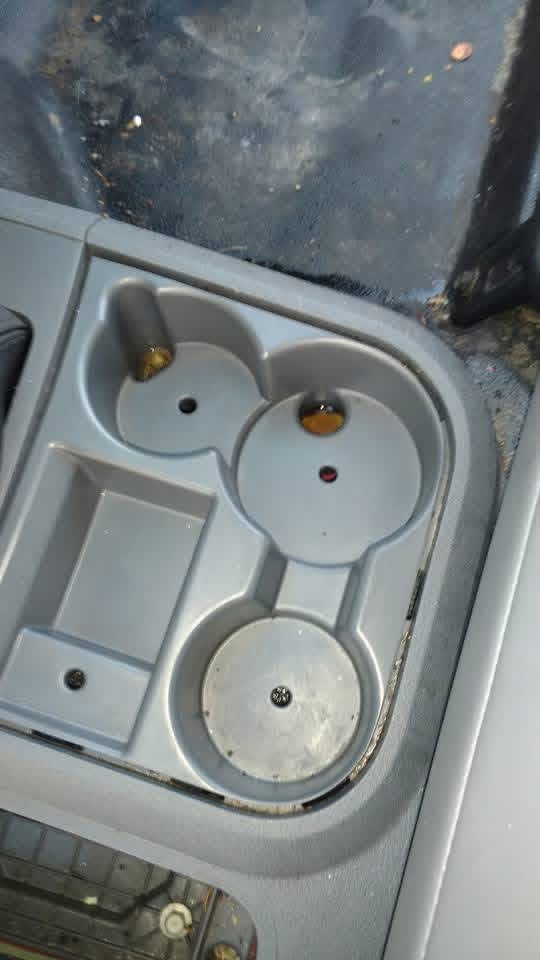 Clean truck center console and cup holders after detailing