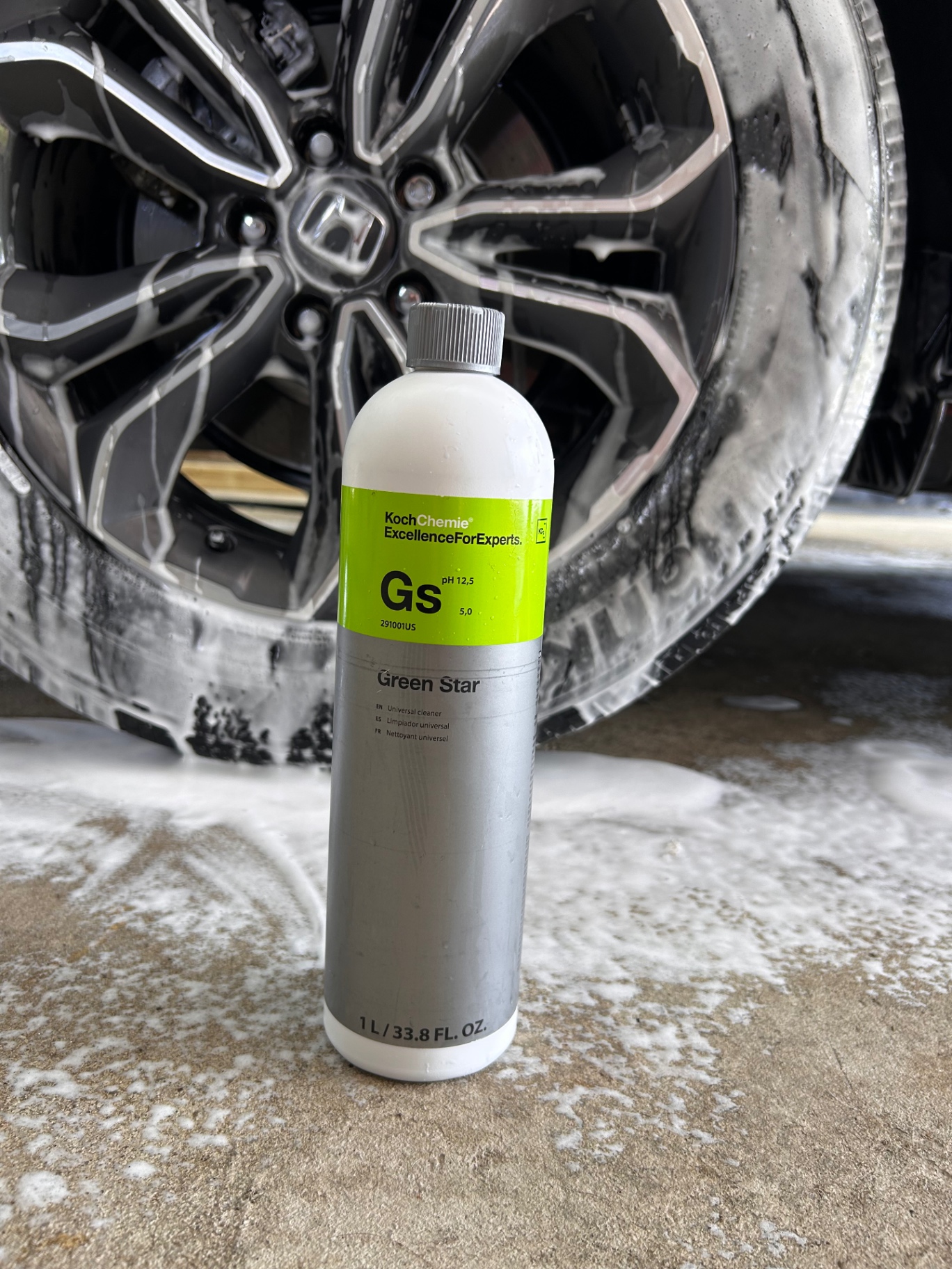 Koch Chemie Green Star cleaner beside a foamed wheel